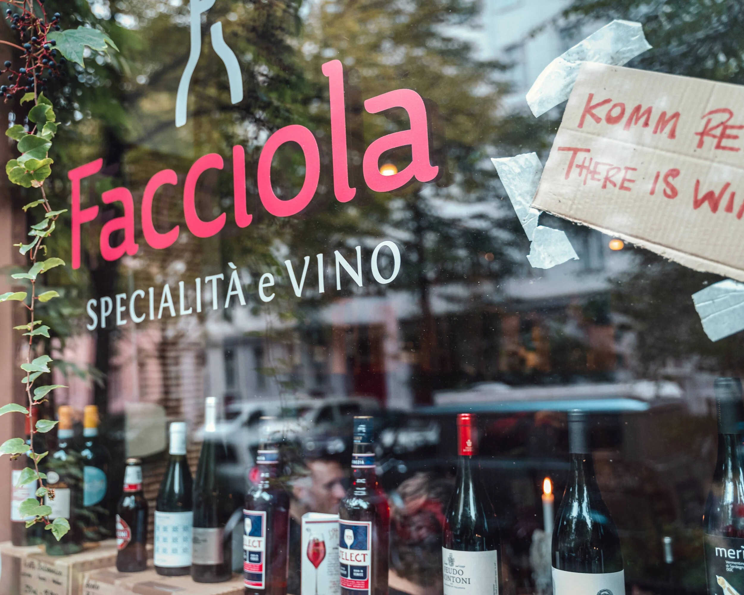 Facciola’s pink sign in the wine bar window